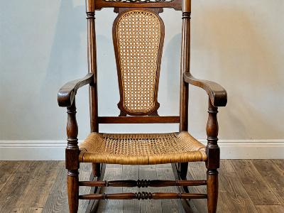 Antique rocking chair after restoration with new cane seat